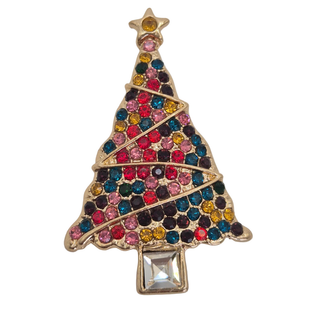 A gold Christmas tree brooch embellished with multicolored rhinestones and a clear square crystal at the base, shown on a plain white background. Close up view. 