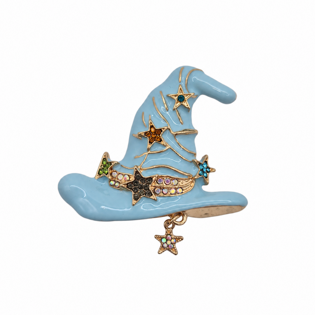 A light blue witch hat brooch with gold-tone metal trim and multiple colorful star charms, shown on a plain white background.