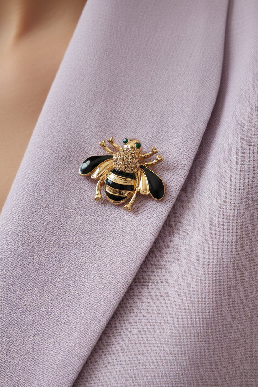 gold and black bee brooch with rhinestone detail