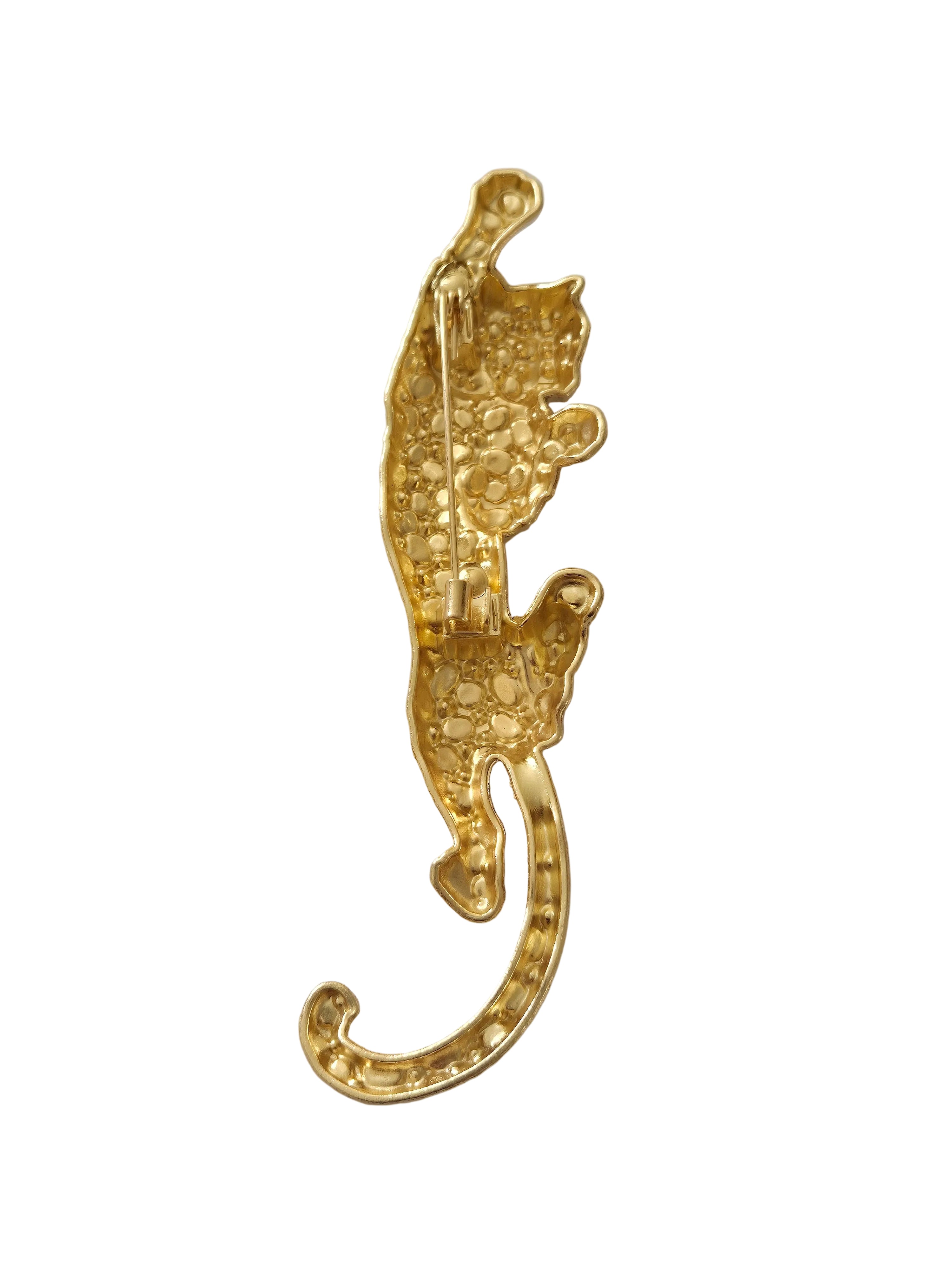 Gold leopard brooch on a gray background