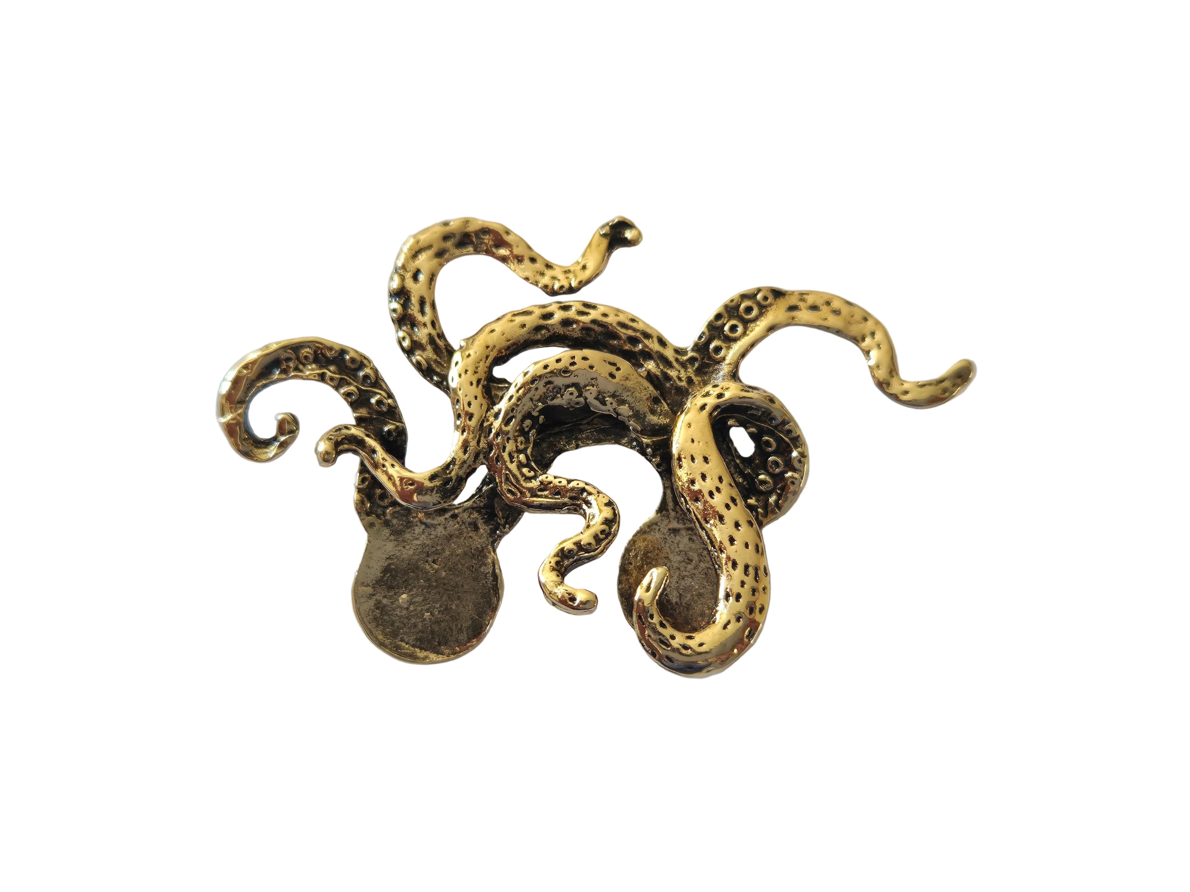 Gold octopus-shaped brooch on a light gray background