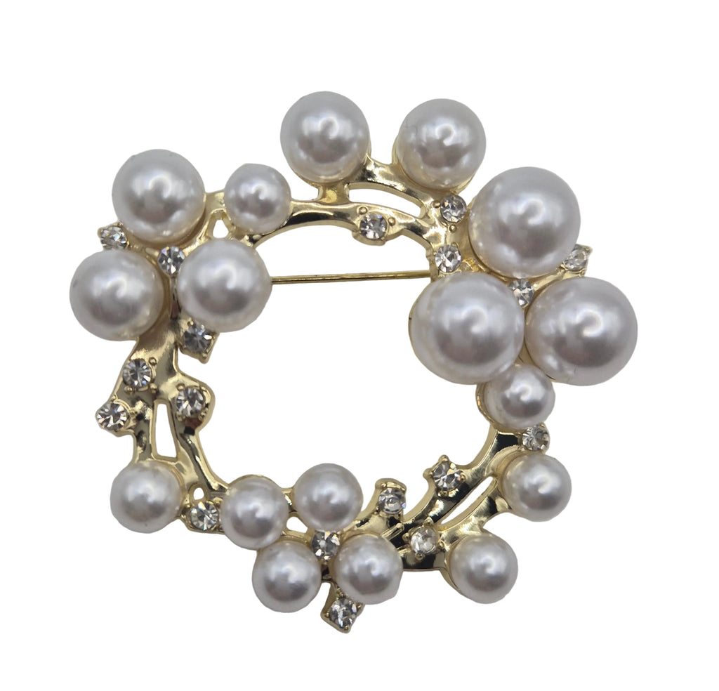 Pearl wreath brooch on a light gray background