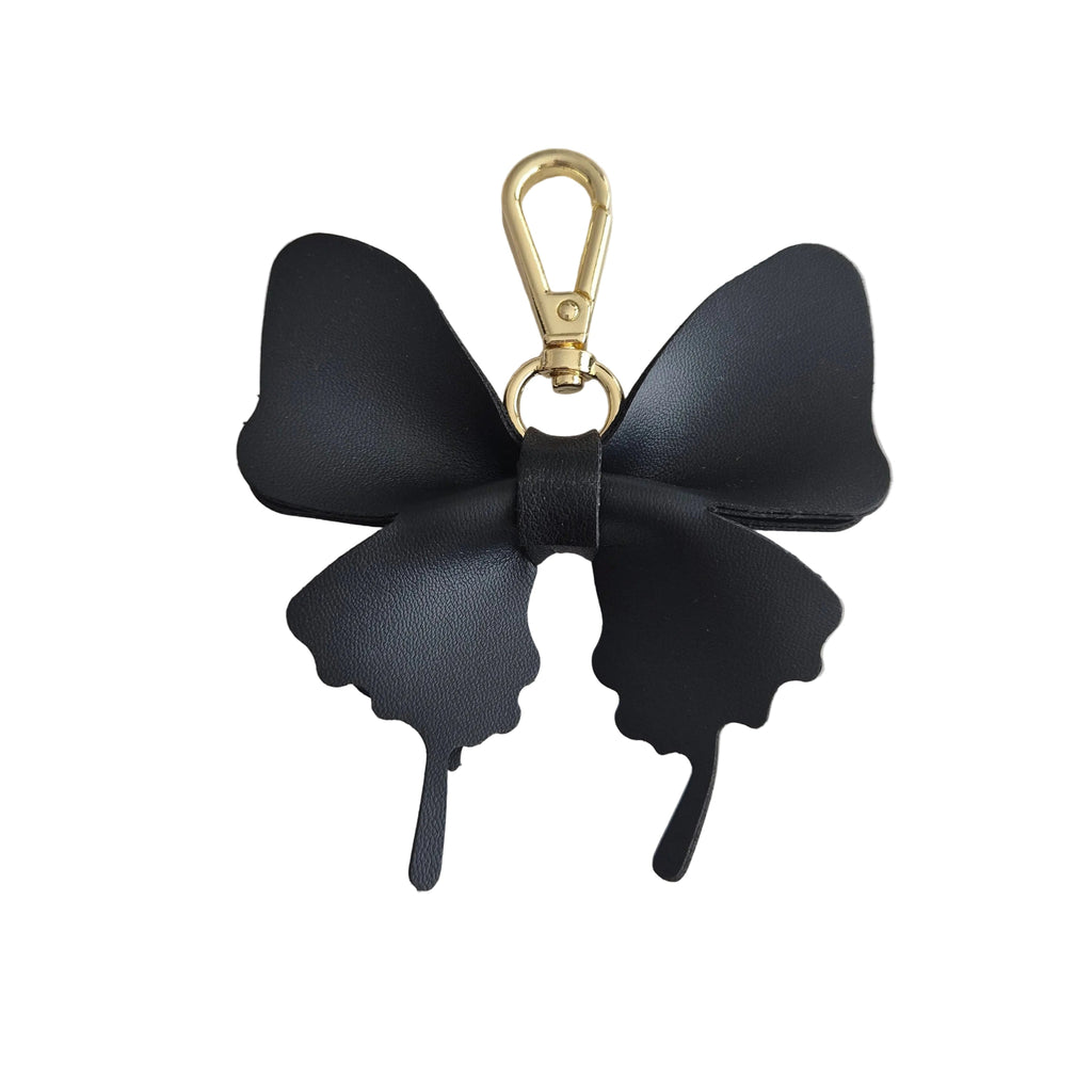 A black butterfly-shaped keychain or bag charm with a gold-tone lobster clasp, shown on a plain white background.