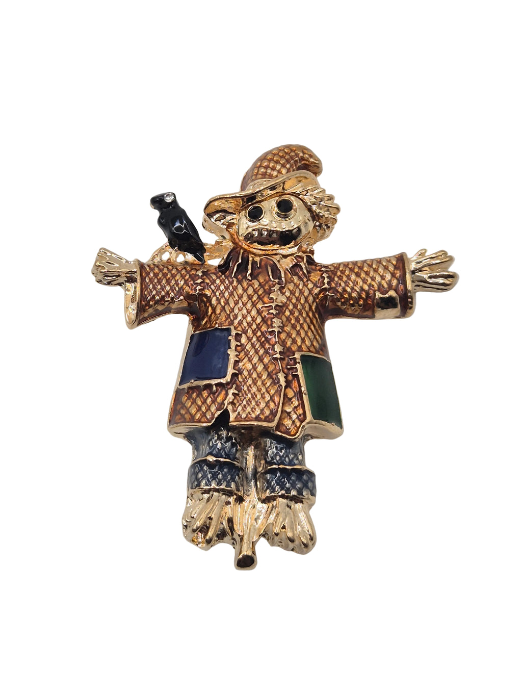 Scarecrow brooch with gold and blue accents on a white background
