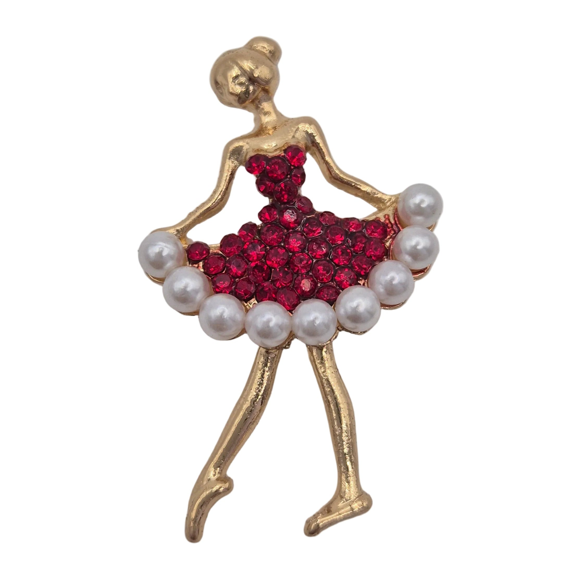 A gold-toned ballerina figurine brooch featuring a red rhinestone-embellished tutu and white faux pearls along the skirt, shown on a plain white background.