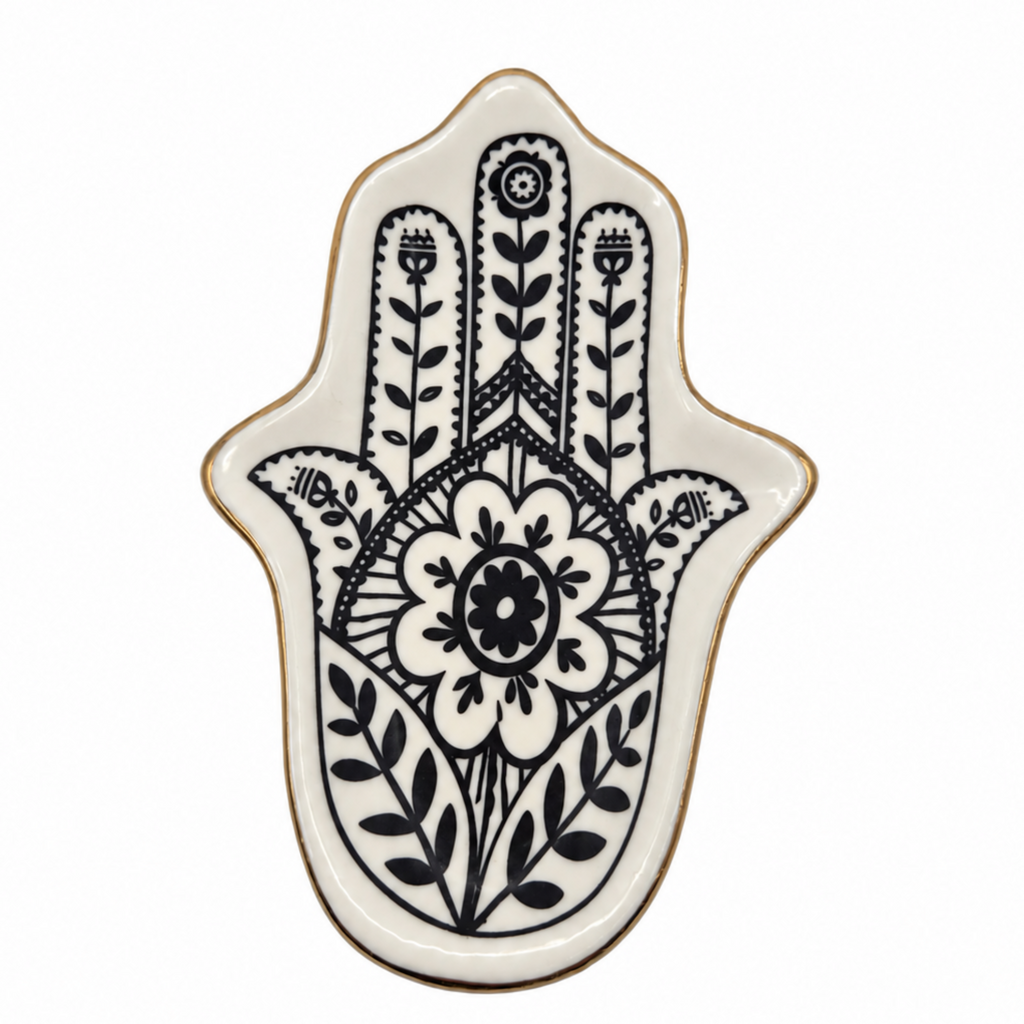 A Hamsa hand tray with a black floral and geometric pattern on an off-white background, finished with a thin gold rim, shown on a solid white background.