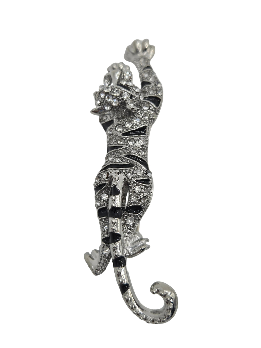 Decorative tiger brooch with intricate design on a light gray background