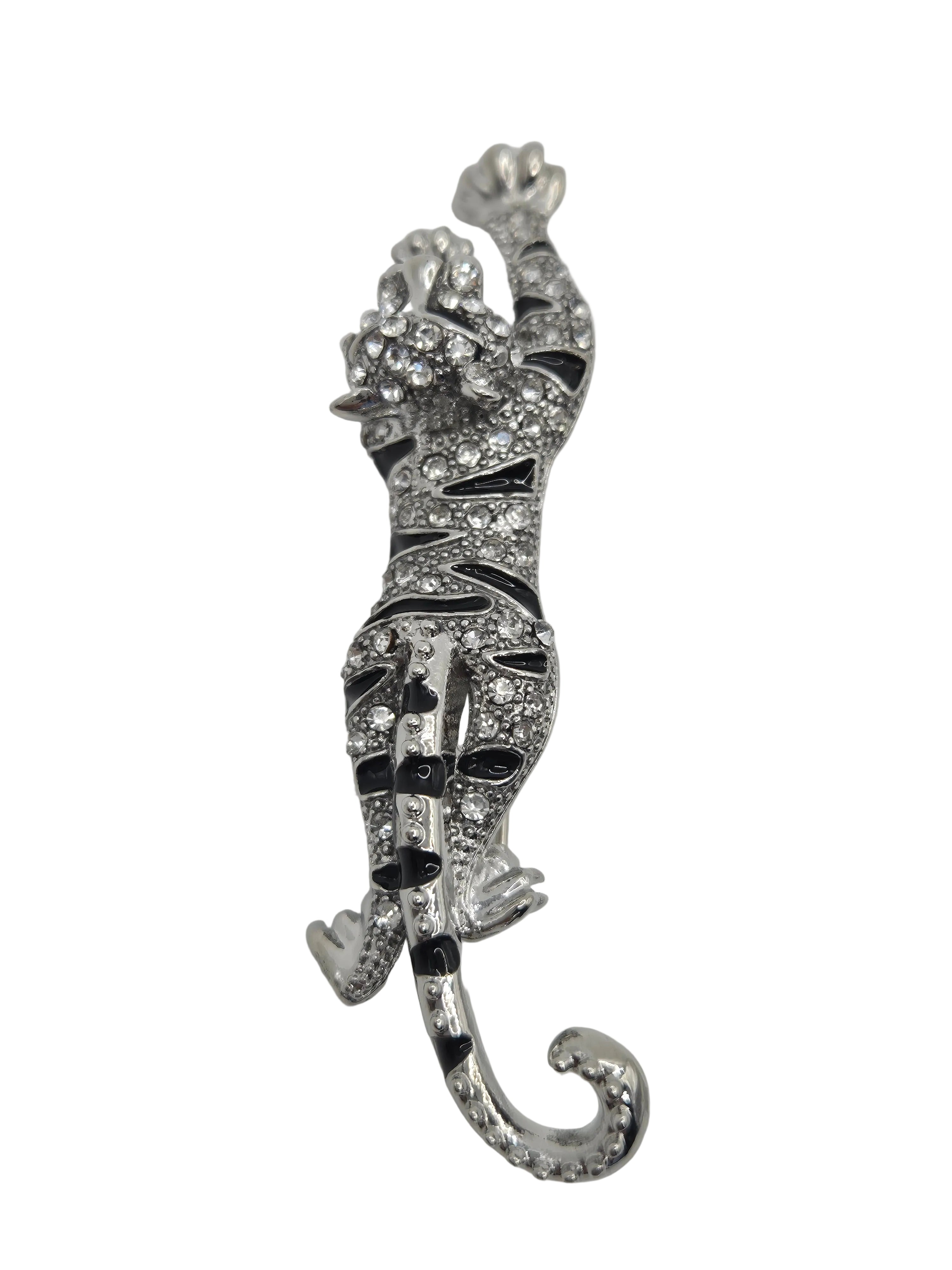Decorative tiger brooch with intricate design on a light gray background