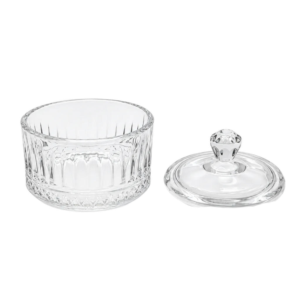 A clear cut-glass or crystal container with a matching round lid featuring a faceted knob, photographed on a clean white background.