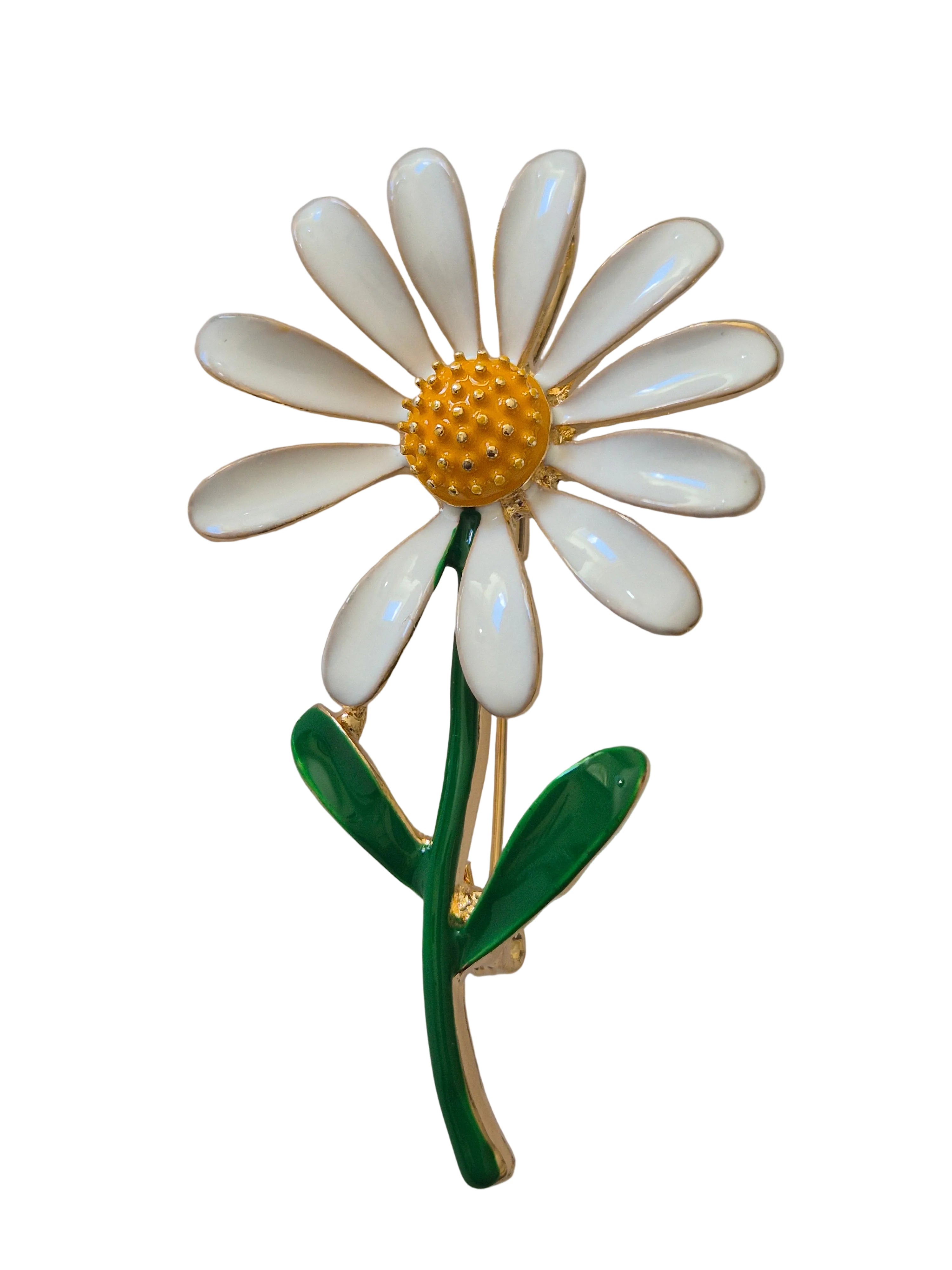 Daisy-shaped brooch with white petals, yellow center, and green stem on a white background