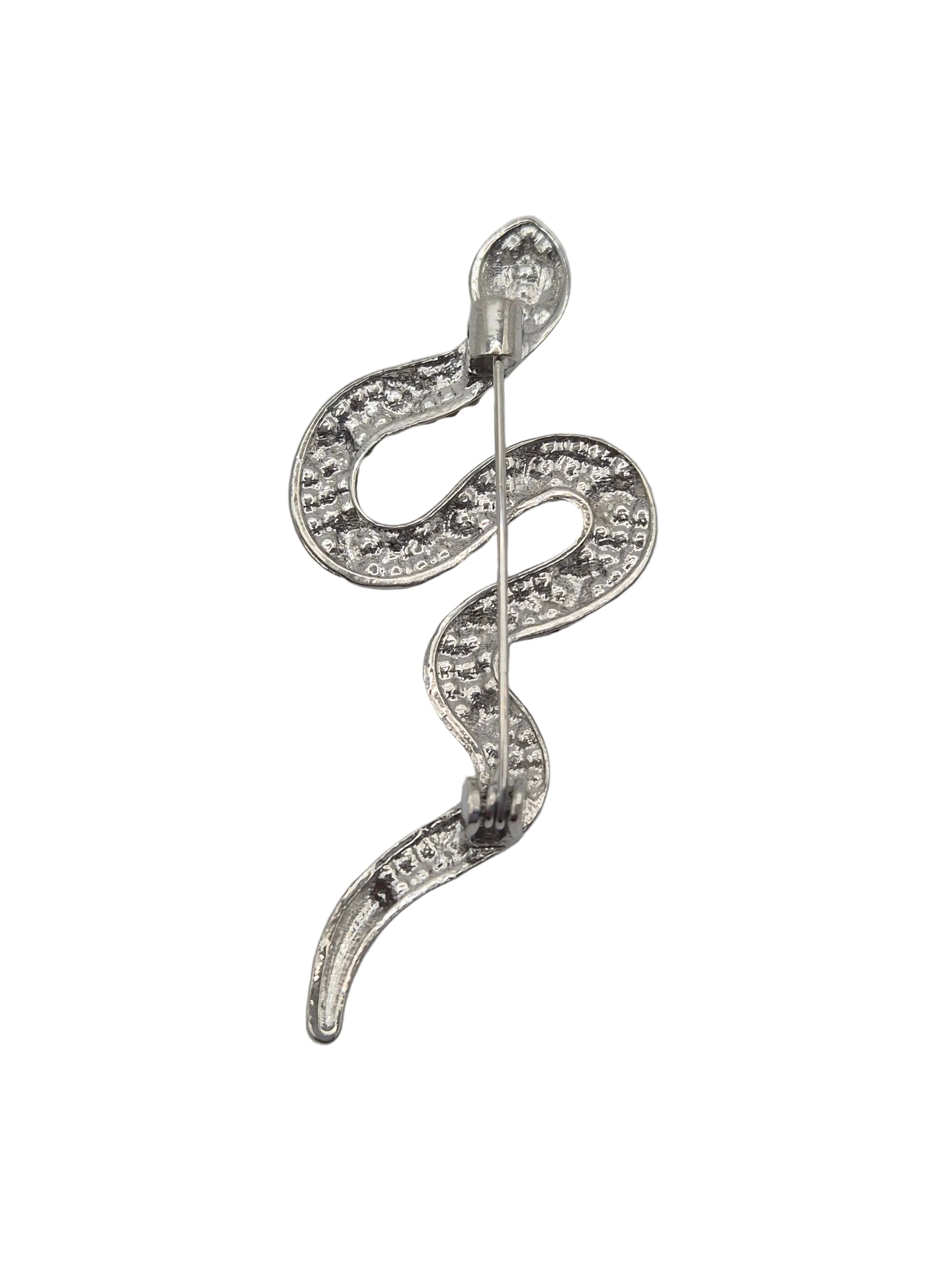 A silver snake-shaped brooch embellished with clear rhinestones, shown against a plain white background.