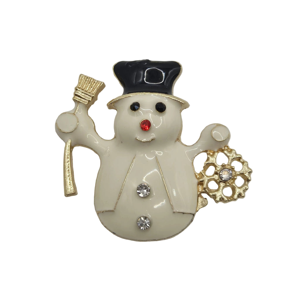 A snowman brooch with an off-white enamel body, a black top hat, gold-tone accessories, and small rhinestone accents, shown on a plain white background.