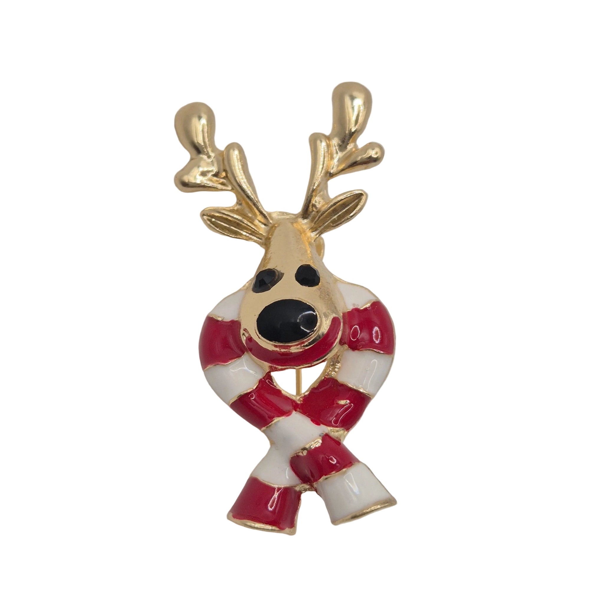 A small Christmas reindeer enamel pin with gold-tone metal, featuring a red and white striped scarf and red-and-white striped antlers, set against a plain white background.