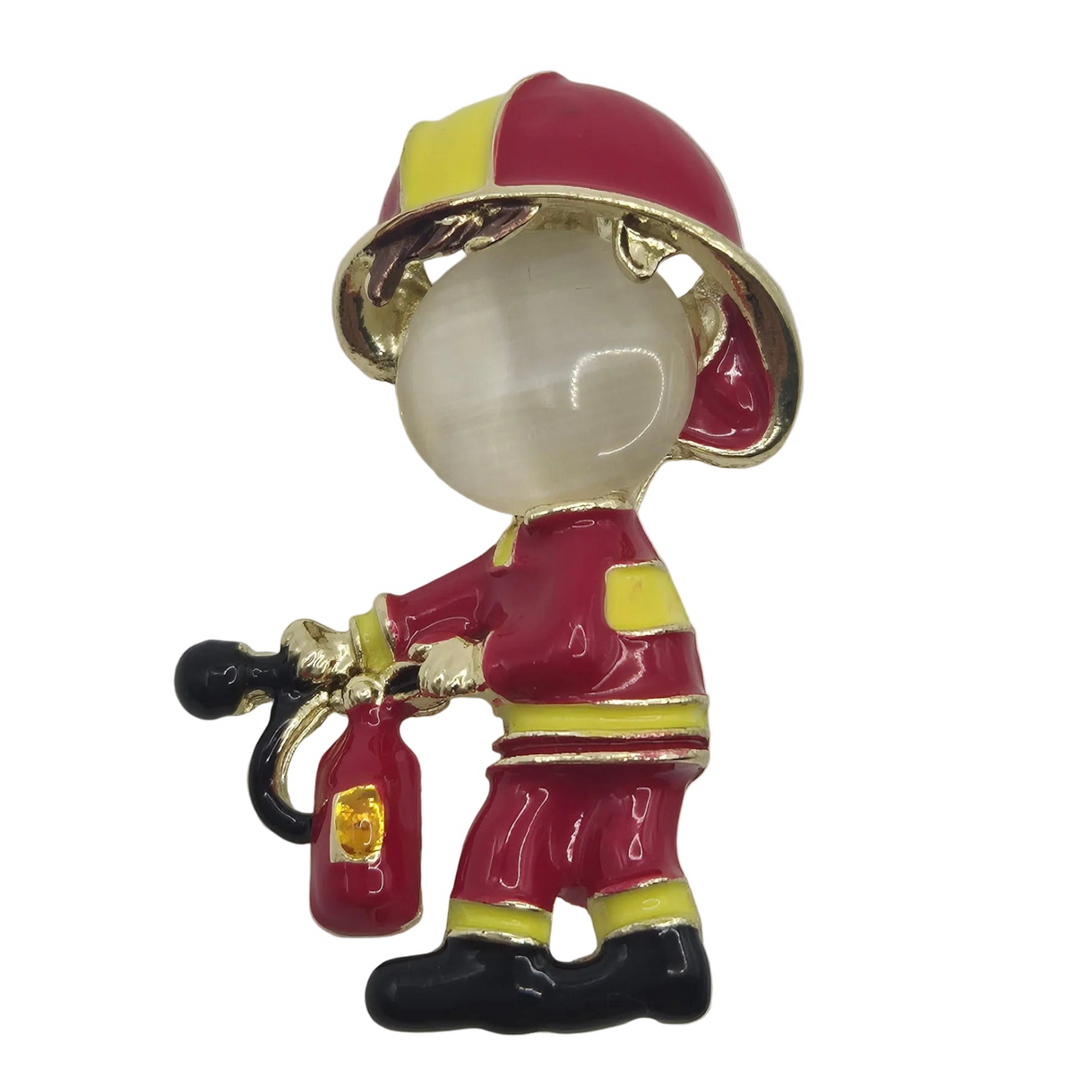 A firefighter-themed brooch featuring a glossy red helmet with yellow accents, a red uniform with yellow details, black boots, and a black-and-red fire extinguisher, set against a plain white background.
