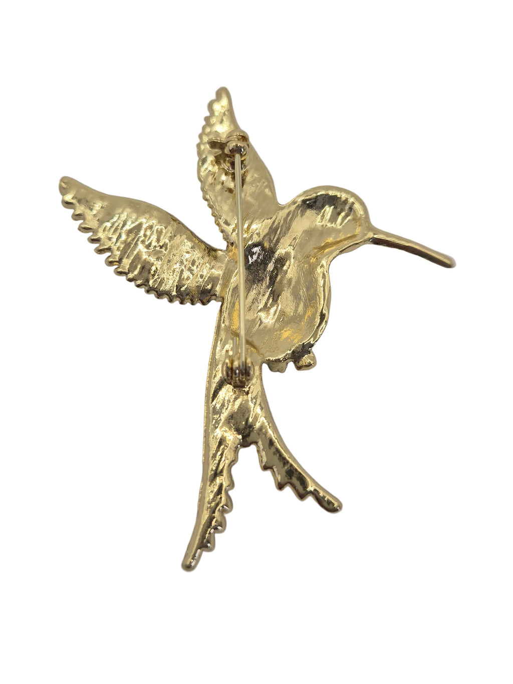 Metal hummingbird brooch with textured wings and a long beak, shown on a plain white background. Reverse side