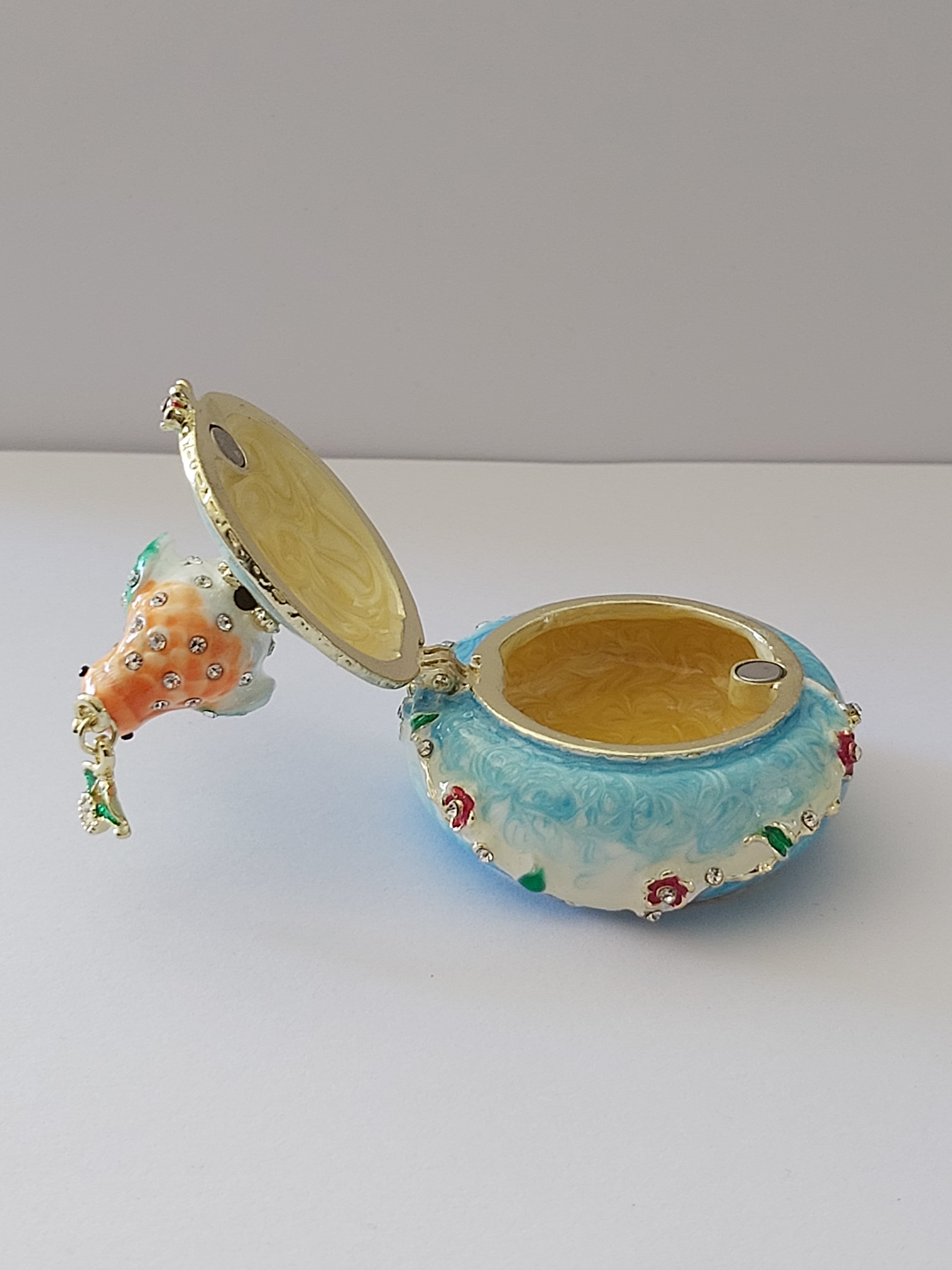 bird trinket pot with rhinestones holding jewel flower