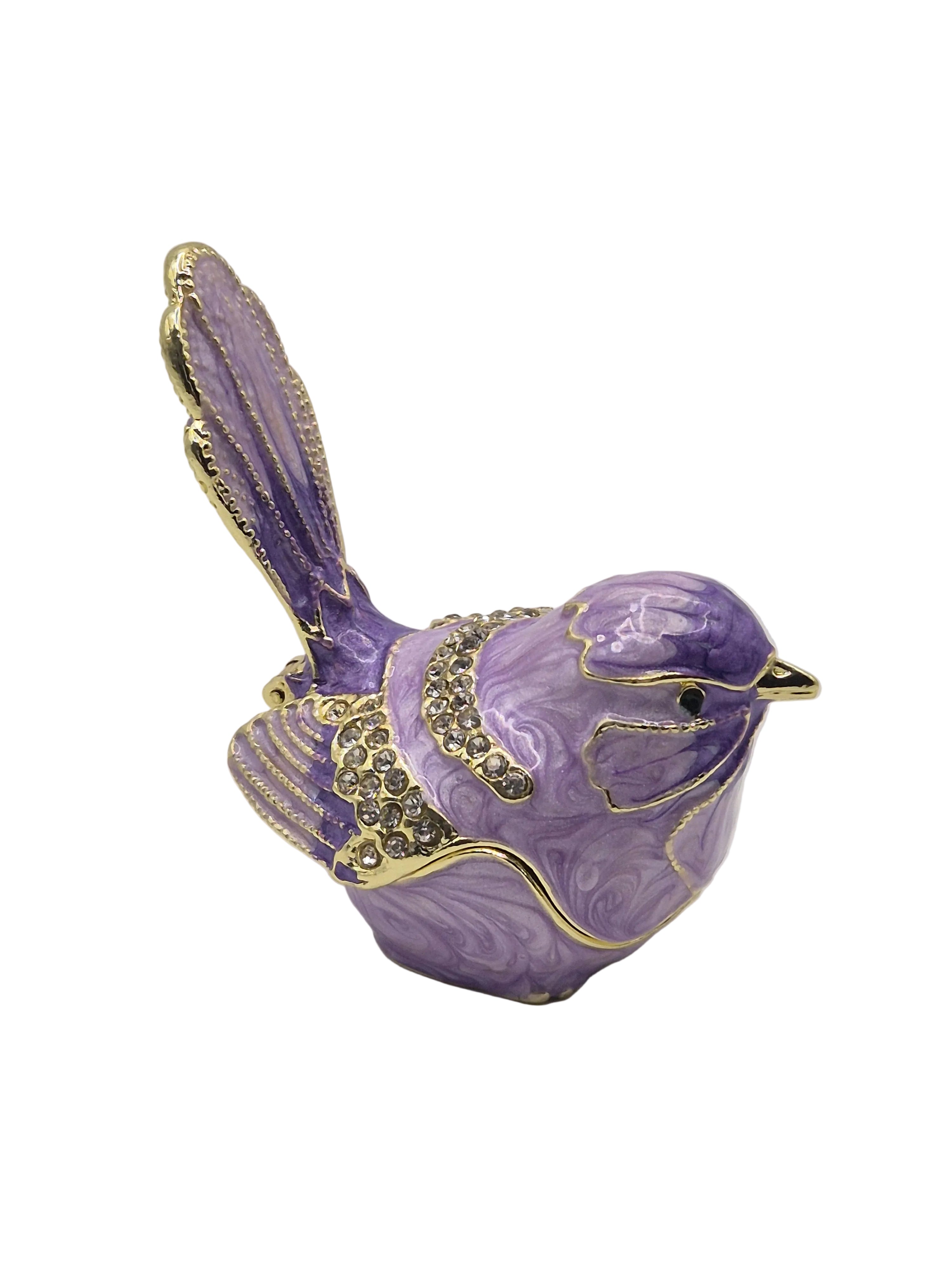 Decorative purple bird trinket pot with gold accents on a white background