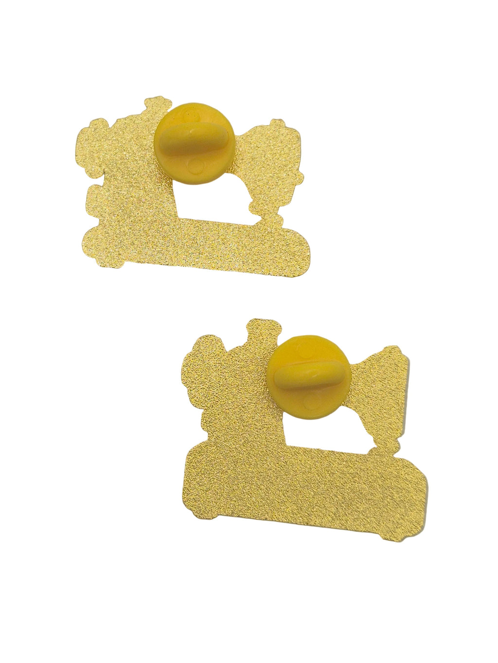 Reverse side of 2 sewing machine pin brooches set against a plain white background.