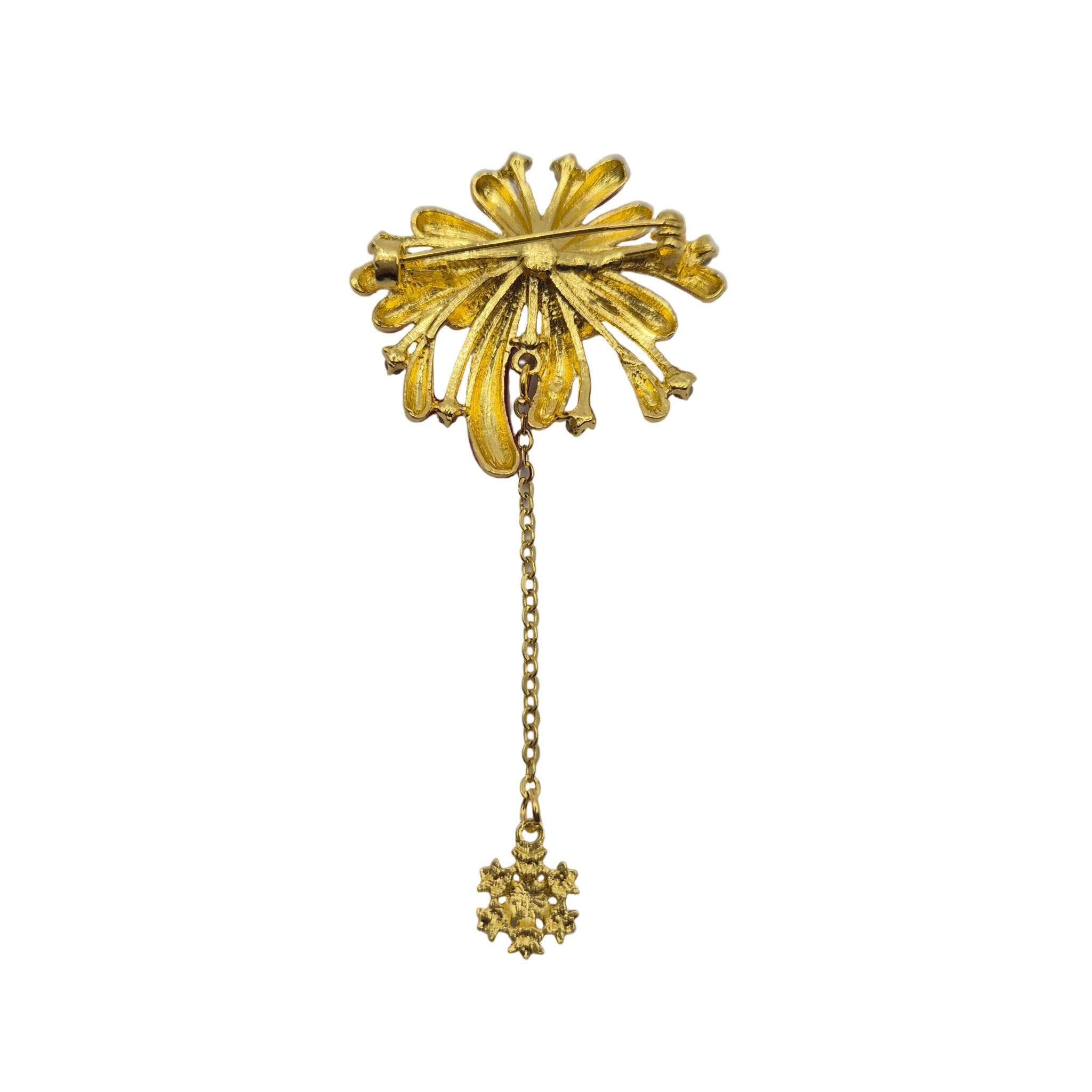 A gold-toned vintage firework brooch with a long chain and a small dangling star pendant, shown on a plain white background.
