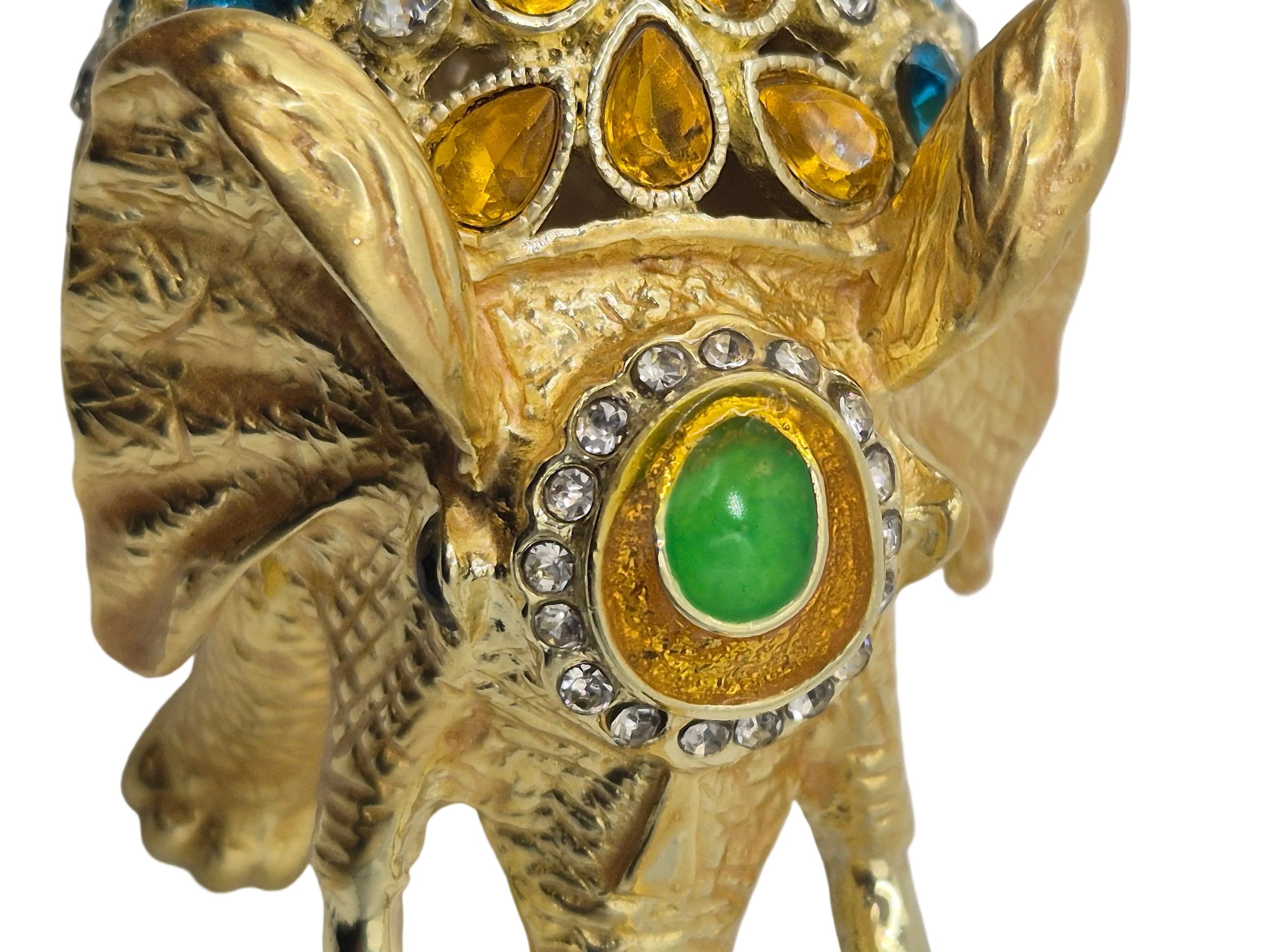 Gold elephant trinket dish with gemstones on a white background