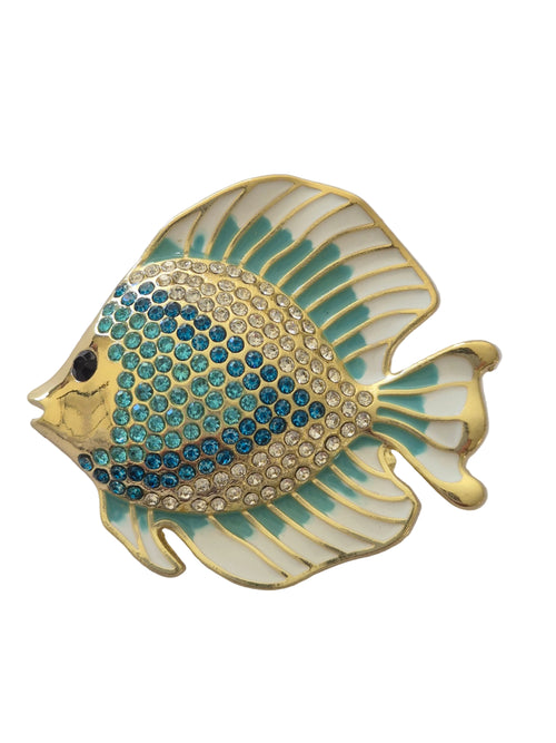 Decorative fish-shaped brooch with gold and blue design on a light gray background