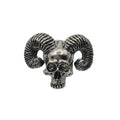 A metallic silver skull pin brooch with curved ram horns, shown against a plain white background.