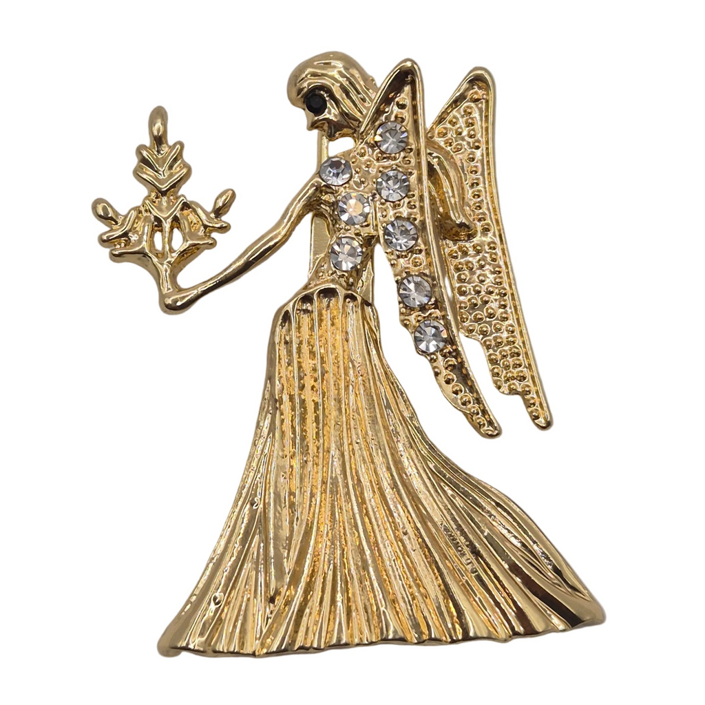 A gold tone Virgo zodiac sign brooch with rhinestone detailing. Shown against a plain white background.