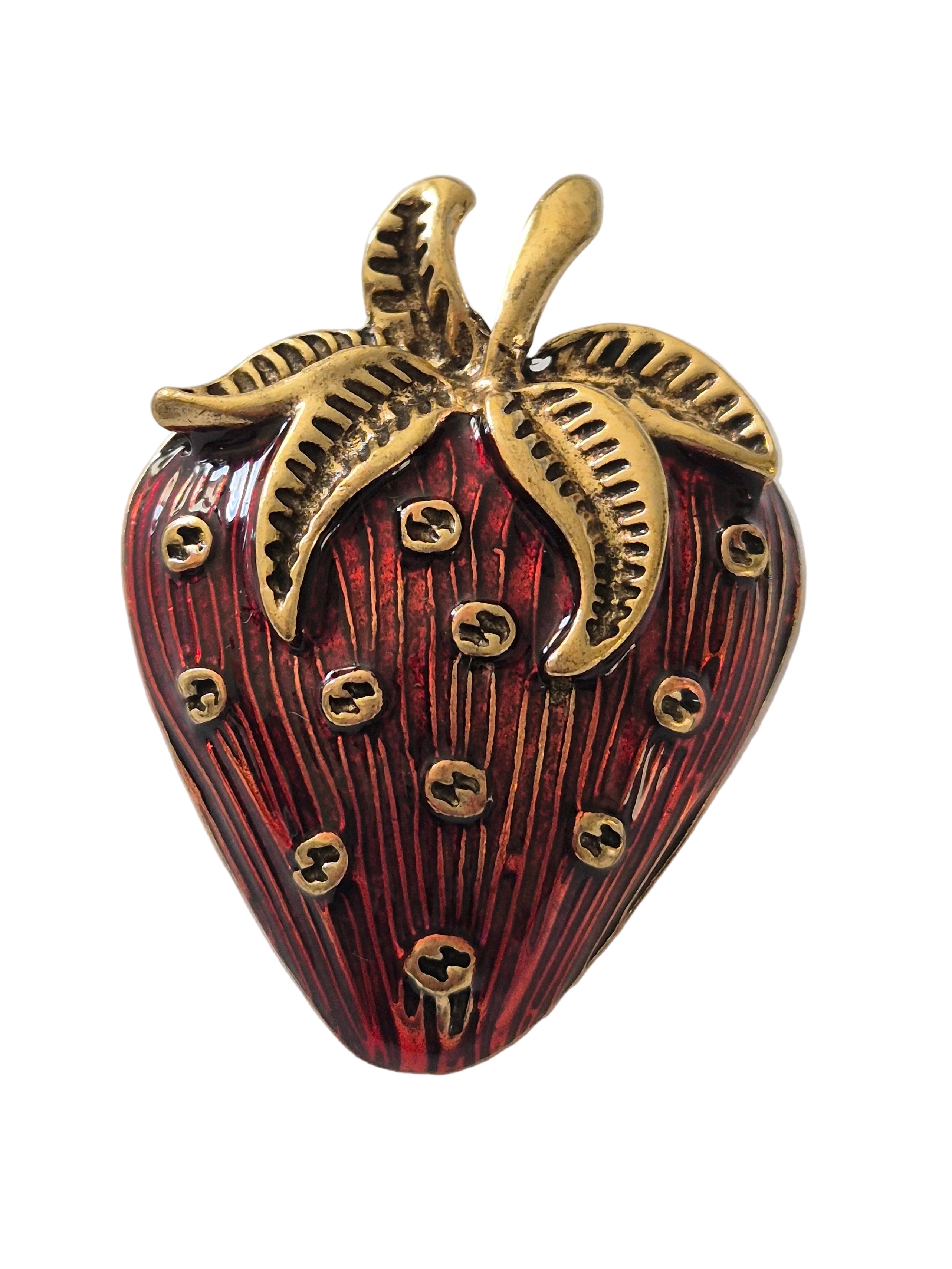 Vintage inspired strawberry brooch with gold and red detail on a white background