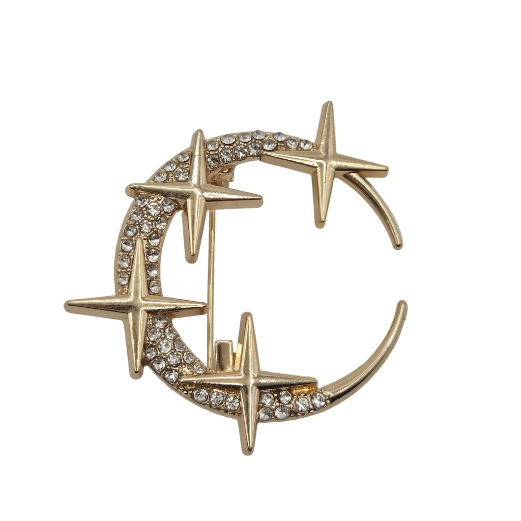 Gold rhinestone moon and stars celestial brooch on white background