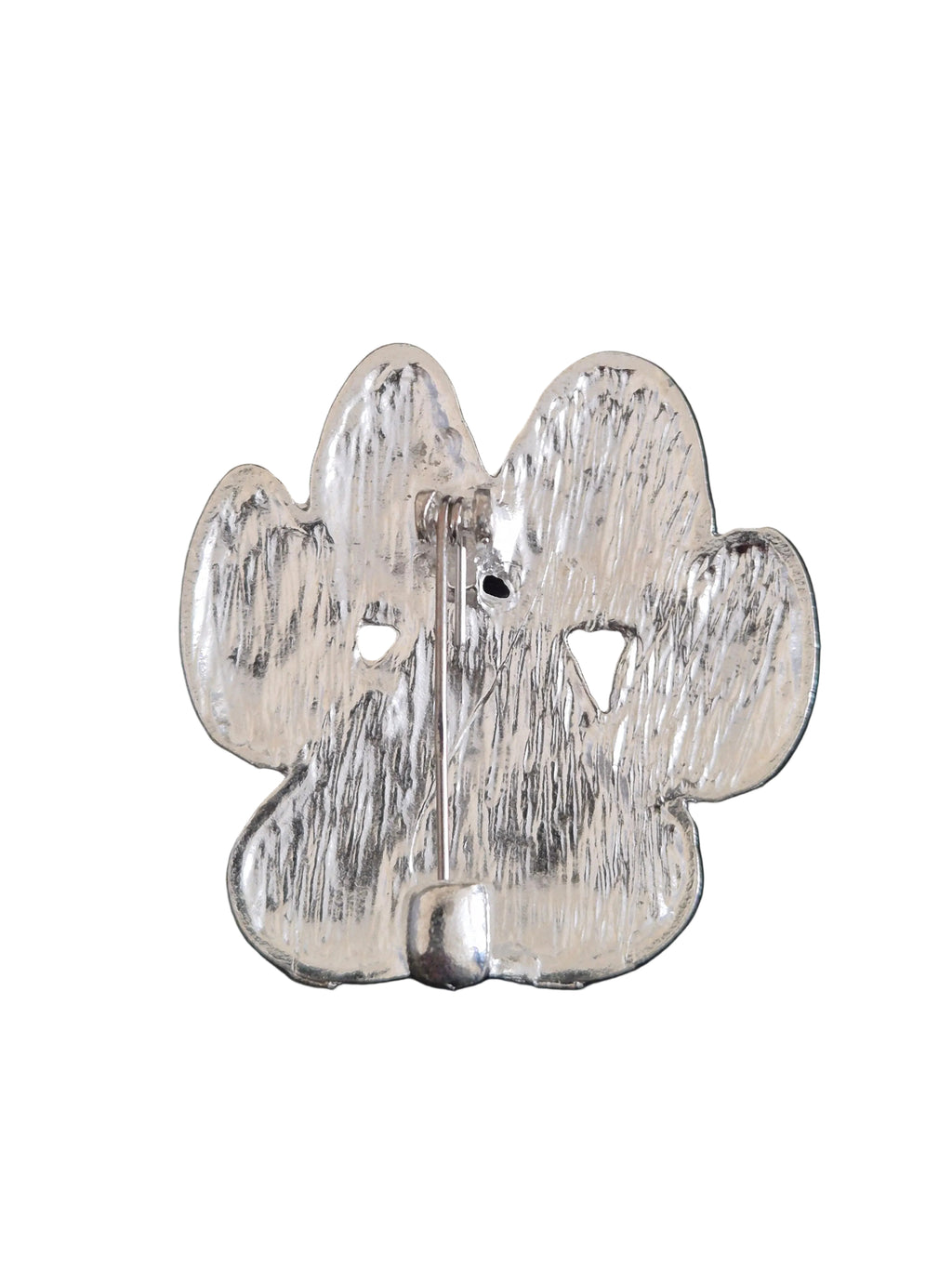 Metallic paw print  brooch on a white background