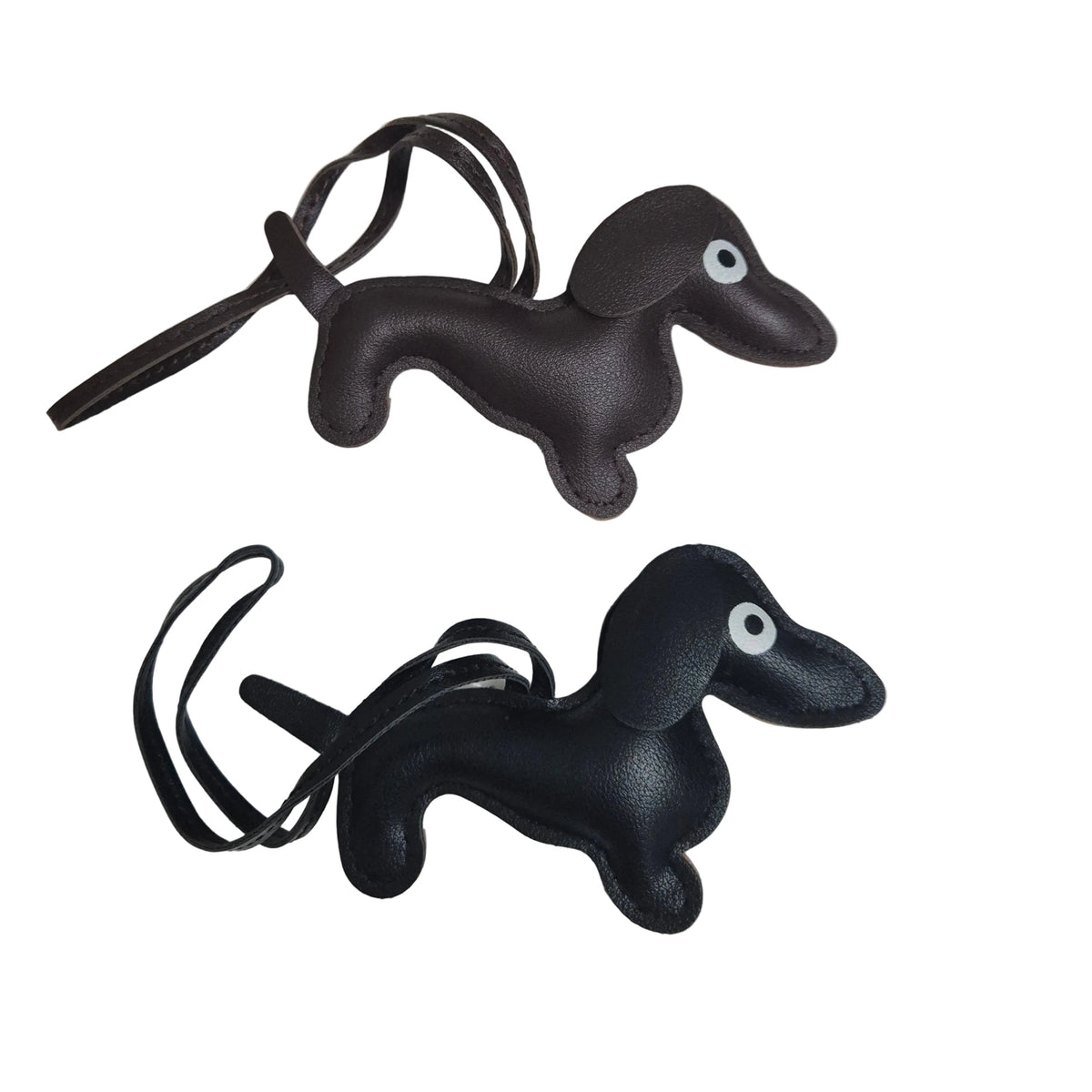 Two faux leather dachshund-shaped keychains with matching key loops, shown on a plain white background.