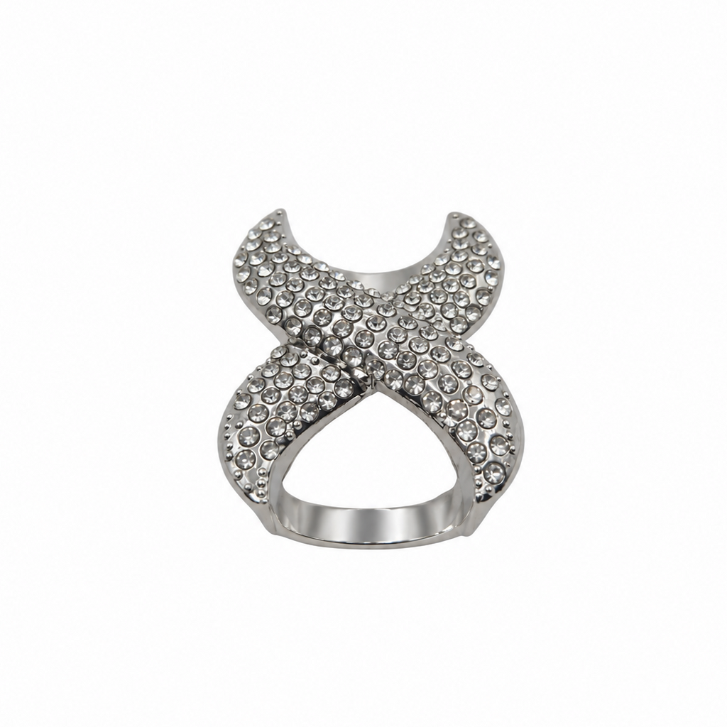 A silver-toned scarf ring featuring an open, interlocking X-shaped design paved with small clear rhinestones, shown against a plain white background.