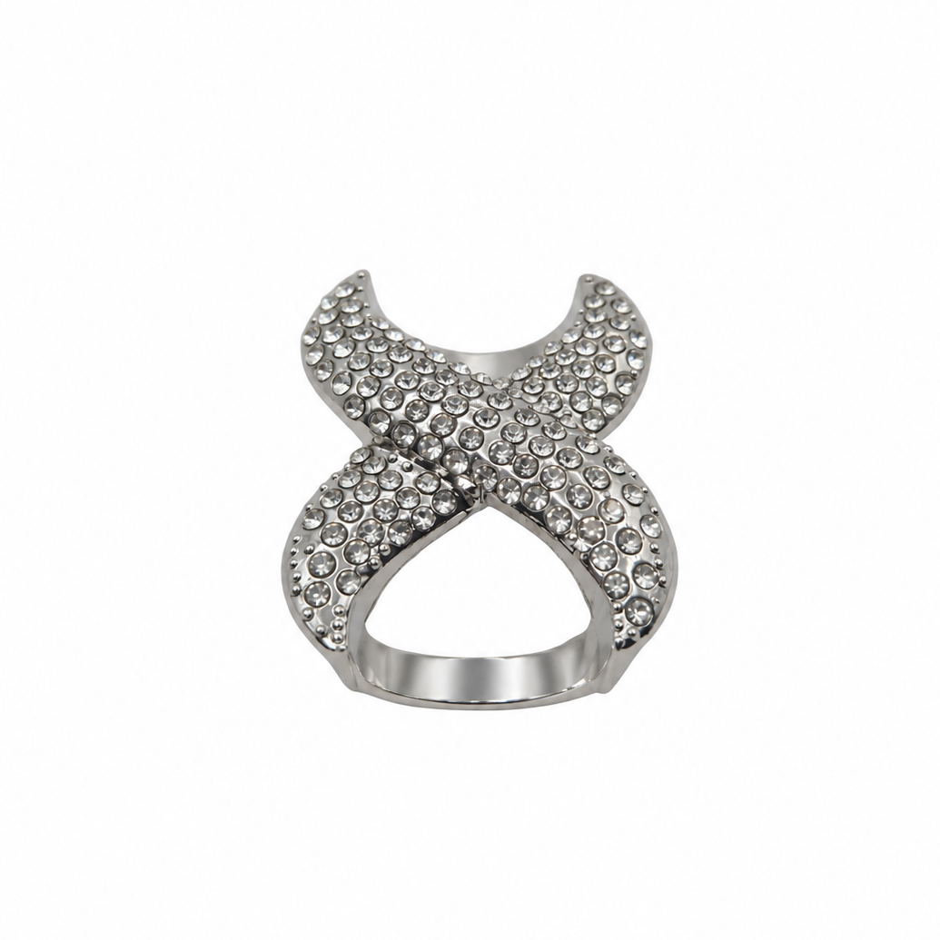 A silver-toned scarf ring featuring an open, interlocking X-shaped design paved with small clear rhinestones, shown against a plain white background.
