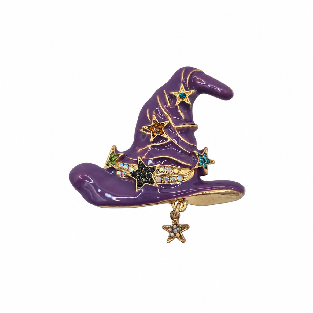 A purple witch hat brooch with gold-tone metal trim, decorated with gold, blue, green, and black star-shaped accents and a dangling gold star charm, shown on a plain white background.