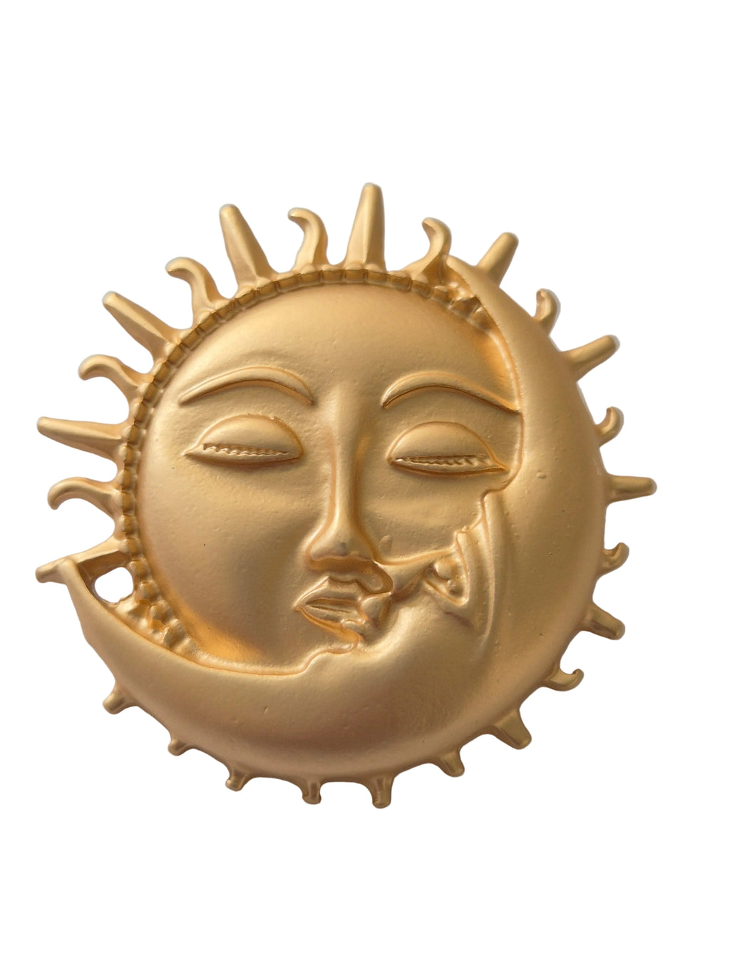 Gold sun and moon face brooch on a white background