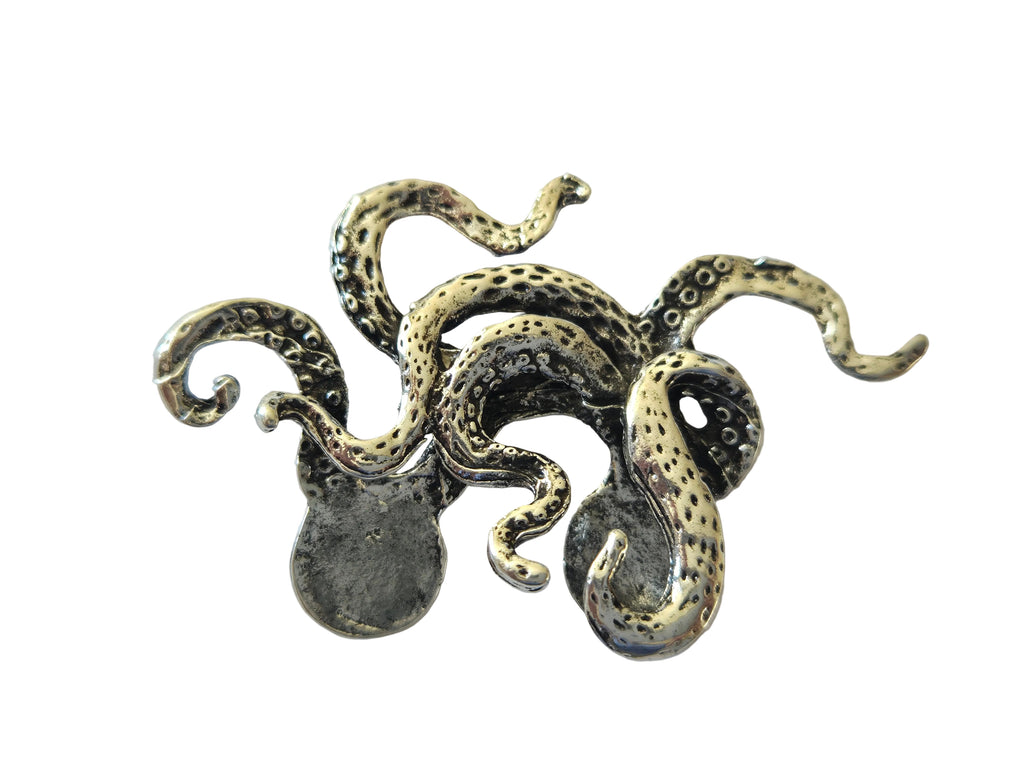 Silver octopus charm brooch on a light gray background