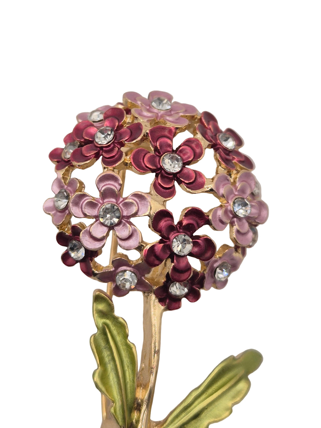 A vintage-style floral brooch featuring multiple small flowers in pink, burgundy, and mauve enamel with clear rhinestones, attached to gold-tone stems with olive green leaves, shown on a plain white background.