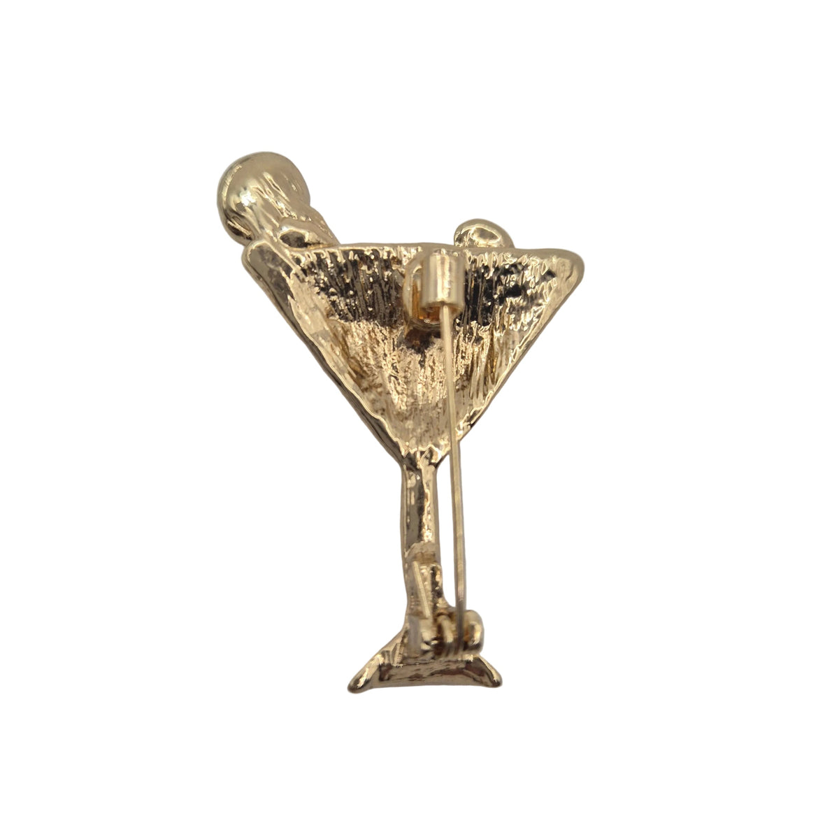 A gold-tone cocktail martini glass brooch with a textured finish and pin clasp, shown on a plain white background.