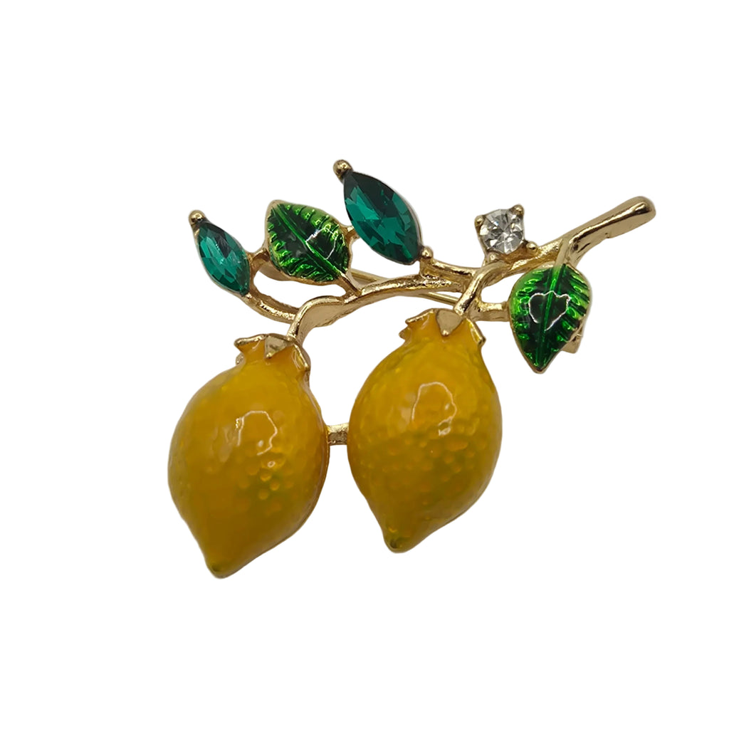 lemons on a branch and green leaves on a light gray background