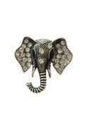 Silver brooch with gemstones on a light gray background elephant brooch