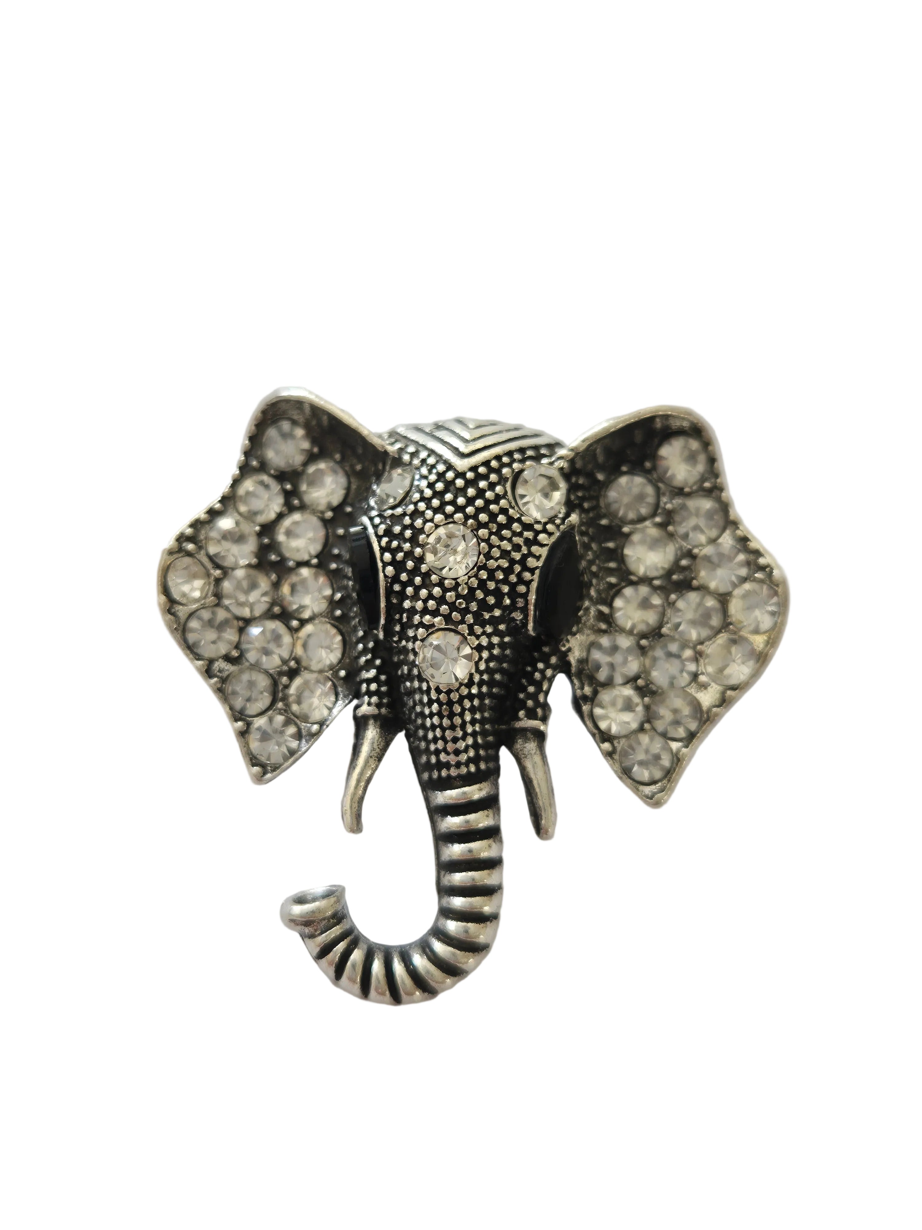 Silver brooch with gemstones on a light gray background elephant brooch