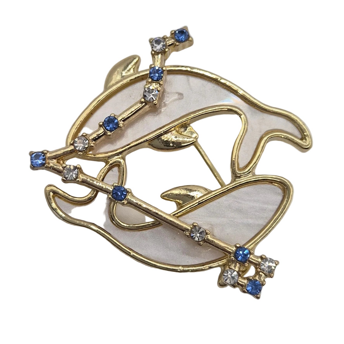 A gold-tone Pisces fish brooch with a milky white mother-of-pearl inlay and small blue and clear rhinestone accents, shown on a plain white background.