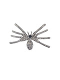 A silver spider-shaped brooch embellished with clear rhinestones and a central black stone, shown on a plain white background.