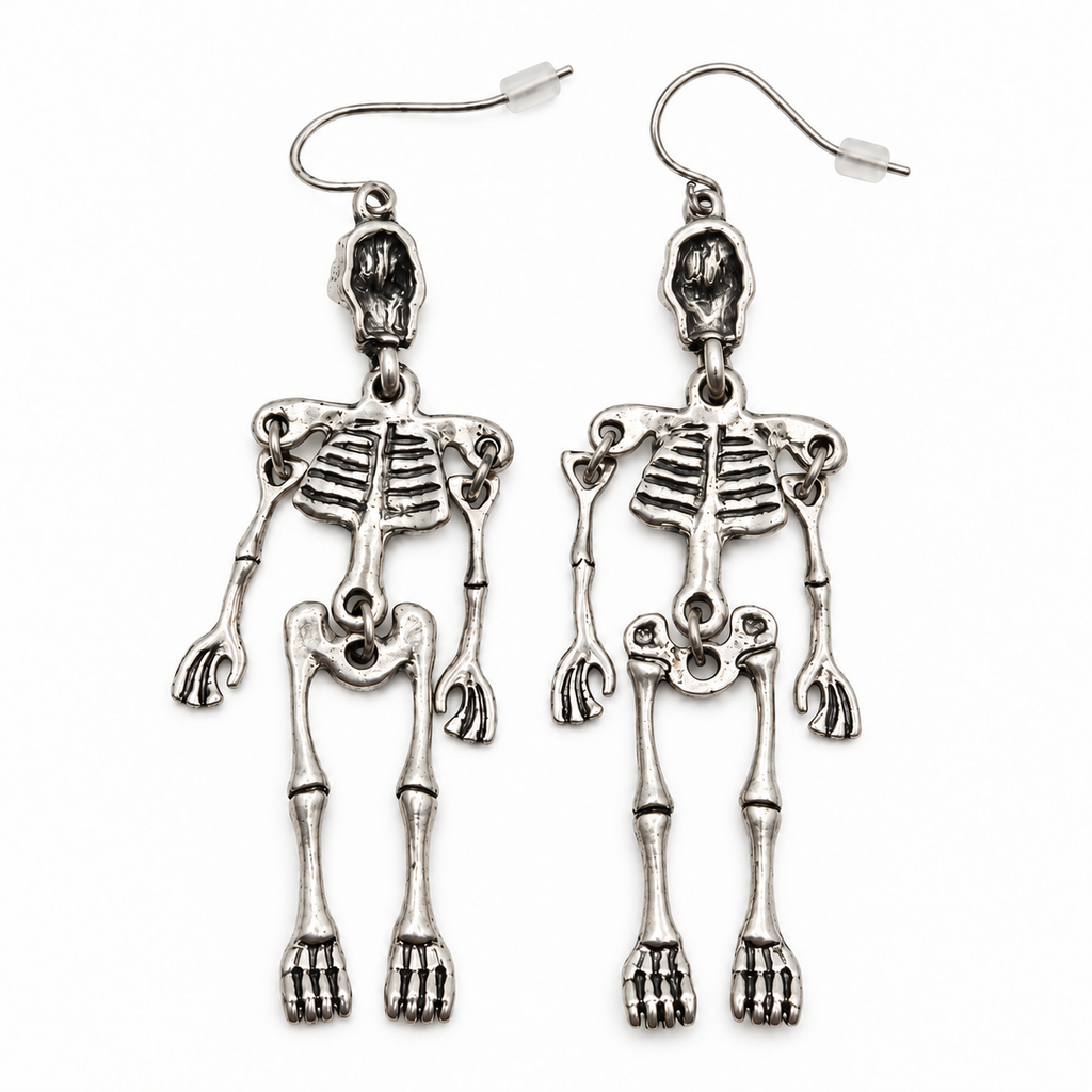 Reverse of silver-tone skeleton drop earrings, showing the backs of the skulls, jointed limbs and curved hooks on a white background.