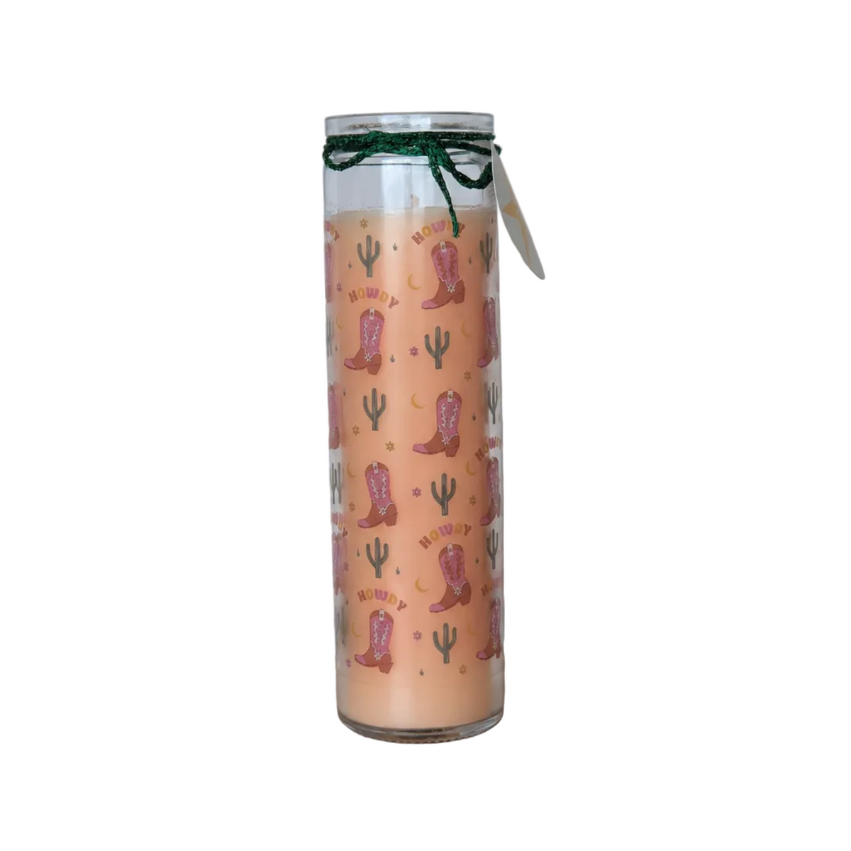 A tall glass jar candle with peach-coloured wax, decorated with a pink and green western boot and cactus pattern, displayed against a plain white background.