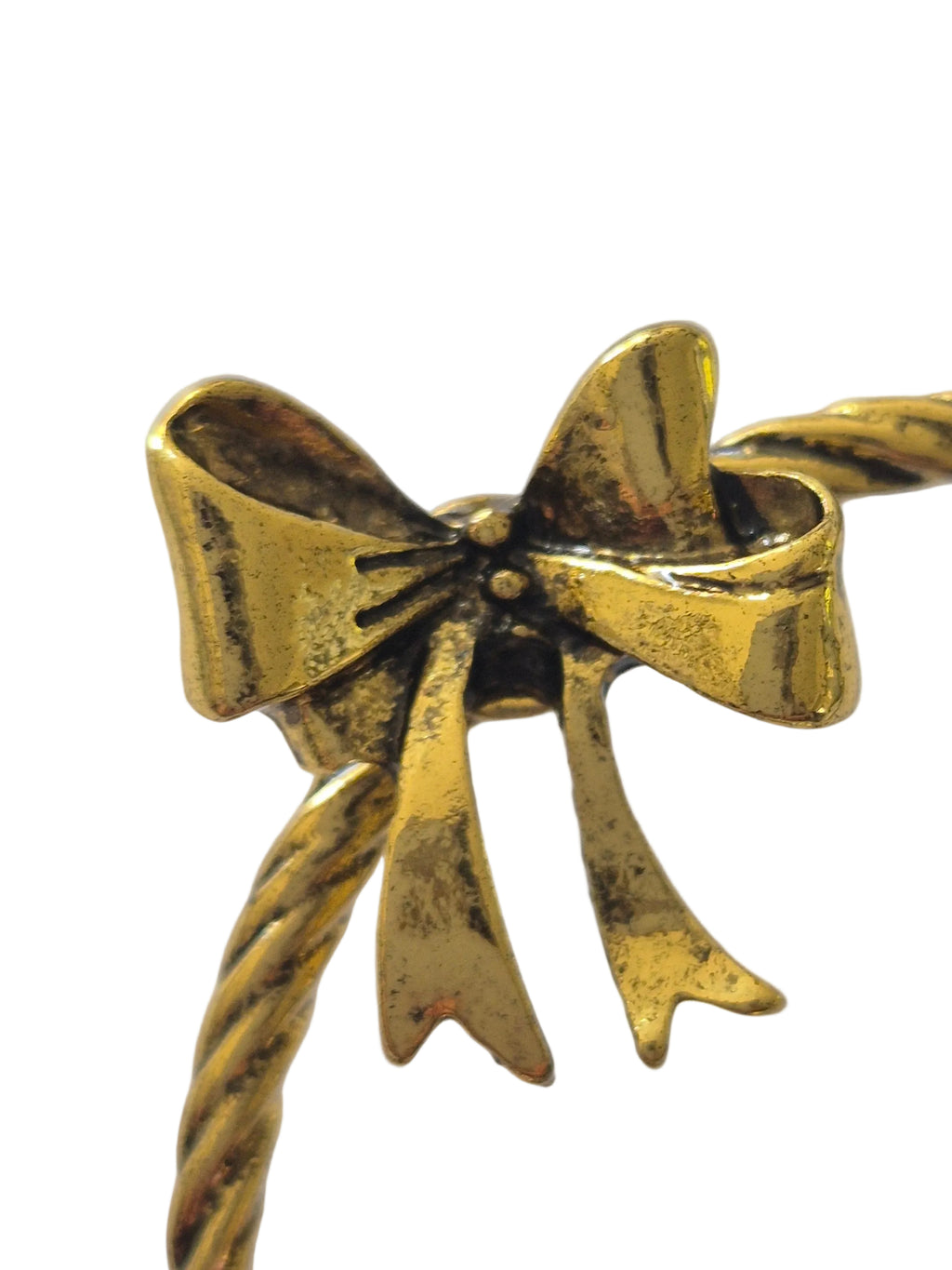 Gold bird brooch on a white background