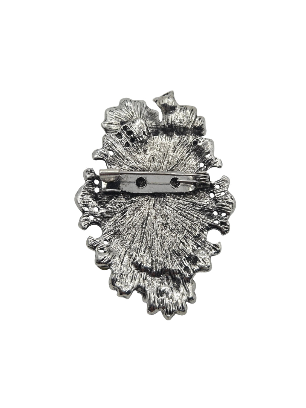 Silver-toned textured metal brooch with a pin clasp, shown from the back on a plain white background.