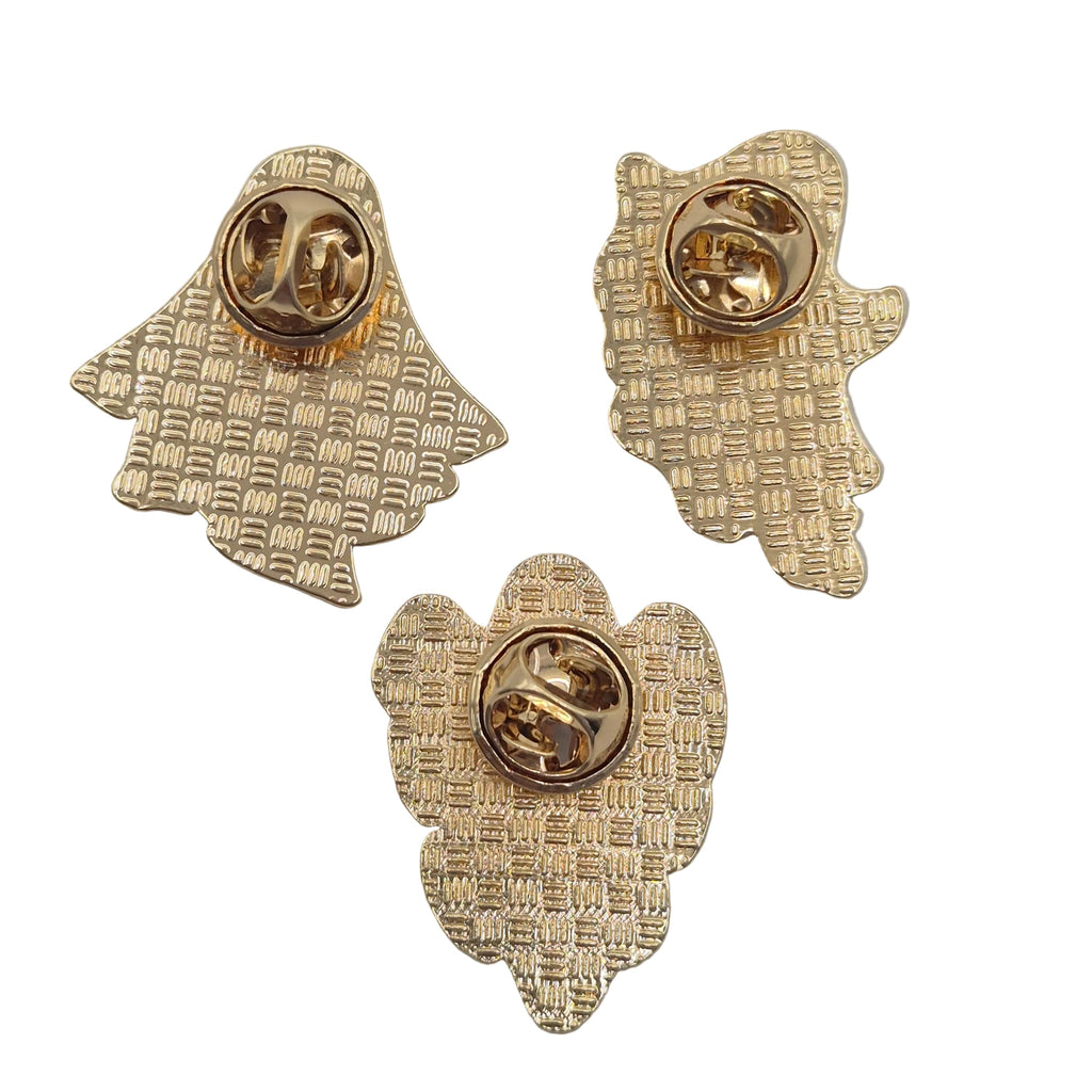 Three gold-toned textured enamel lapel pins with round metal clutch backings, arranged on a plain white surface.