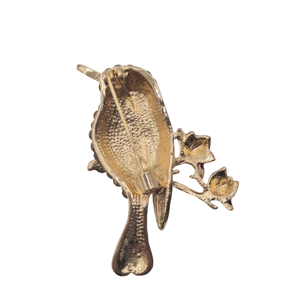 reverse side bird brooch on white background