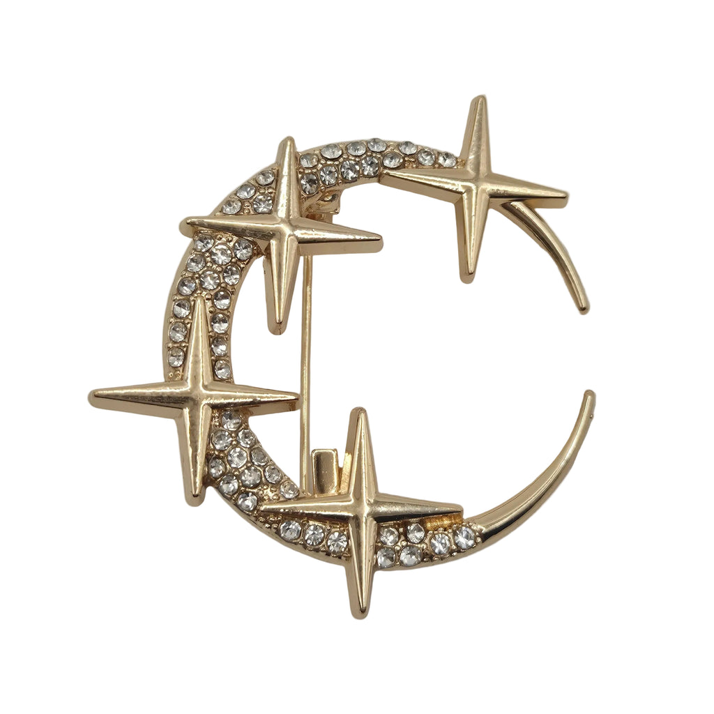 Gold rhinestone moon and stars celestial brooch on white background